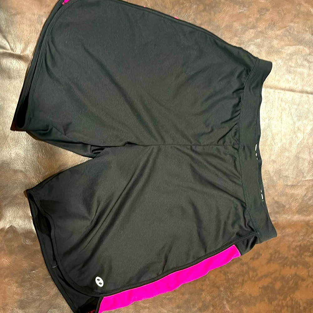 Woman’s black with pink stripes, basketball shorts
